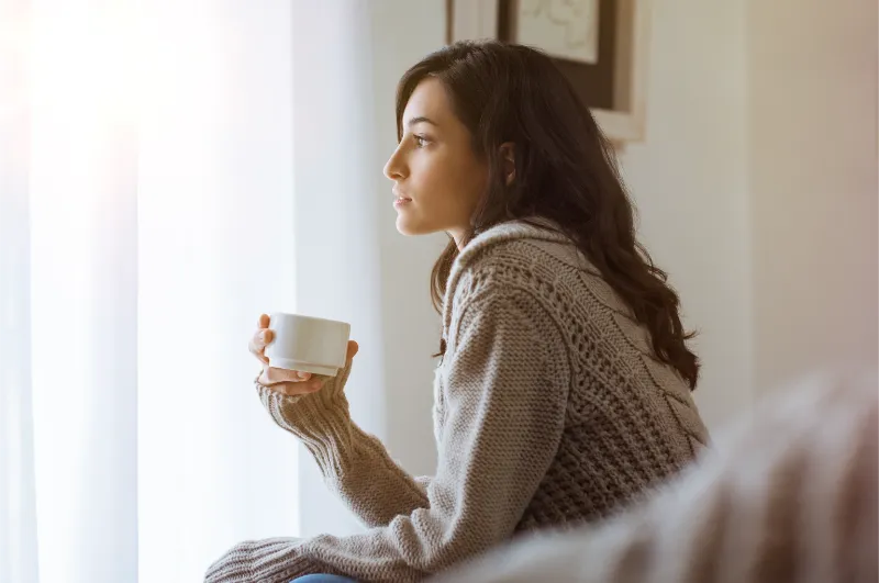 woman holding a mug